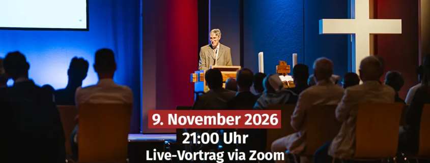 Veranstaltungshinweis für einen Live-Vortrag via Zoom mit Prof. Dr. Markus Zehnder. Das Bild zeigt einen Redner an einem Pult auf einer beleuchteten Bühne mit großem Kreuz neben einem Publikum, überlagert mit den Textangaben Datum 9. November 2026, 21:00 Uhr und Live-Vortrag via Zoom.